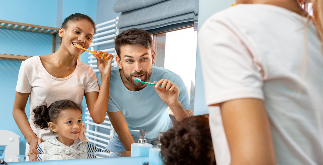 Family brushing teeth