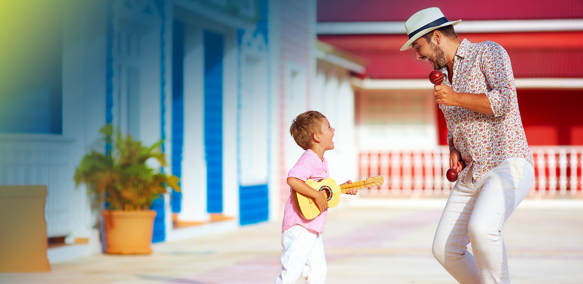 Man and boy playing guitar