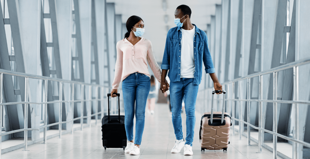 Couple with masks at airport